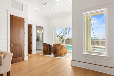 Anchored in the exclusive Palm Court enclave just south of 30A