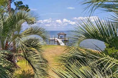 Live the dream in this spectacular Bay front oasis thoughtfully