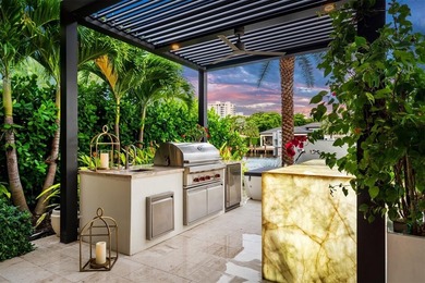 TIMELESS WATERFRONT MASTERPIECE IN EXCLUSIVE HARBOR BEACH! A