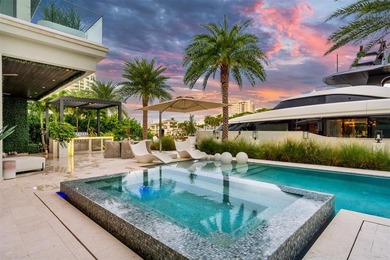 TIMELESS WATERFRONT MASTERPIECE IN EXCLUSIVE HARBOR BEACH! A