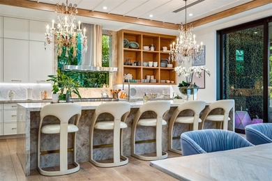 TIMELESS WATERFRONT MASTERPIECE IN EXCLUSIVE HARBOR BEACH! A