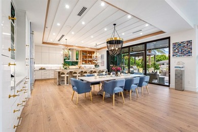 TIMELESS WATERFRONT MASTERPIECE IN EXCLUSIVE HARBOR BEACH! A