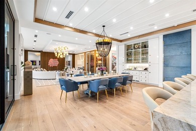 TIMELESS WATERFRONT MASTERPIECE IN EXCLUSIVE HARBOR BEACH! A