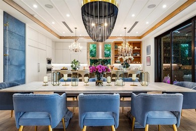 TIMELESS WATERFRONT MASTERPIECE IN EXCLUSIVE HARBOR BEACH! A