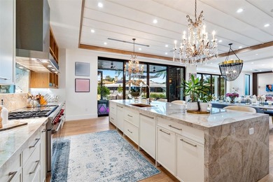 TIMELESS WATERFRONT MASTERPIECE IN EXCLUSIVE HARBOR BEACH! A