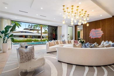 TIMELESS WATERFRONT MASTERPIECE IN EXCLUSIVE HARBOR BEACH! A