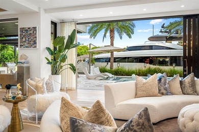 TIMELESS WATERFRONT MASTERPIECE IN EXCLUSIVE HARBOR BEACH! A