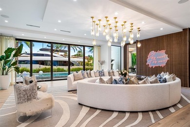 TIMELESS WATERFRONT MASTERPIECE IN EXCLUSIVE HARBOR BEACH! A