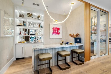 TIMELESS WATERFRONT MASTERPIECE IN EXCLUSIVE HARBOR BEACH! A