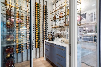 TIMELESS WATERFRONT MASTERPIECE IN EXCLUSIVE HARBOR BEACH! A