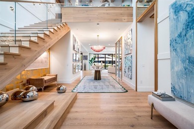 TIMELESS WATERFRONT MASTERPIECE IN EXCLUSIVE HARBOR BEACH! A