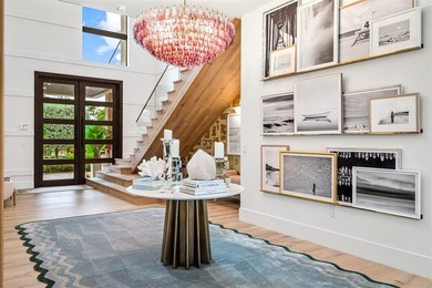 TIMELESS WATERFRONT MASTERPIECE IN EXCLUSIVE HARBOR BEACH! A