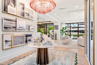 TIMELESS WATERFRONT MASTERPIECE IN EXCLUSIVE HARBOR BEACH! A