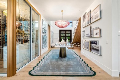 TIMELESS WATERFRONT MASTERPIECE IN EXCLUSIVE HARBOR BEACH! A