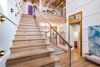 TIMELESS WATERFRONT MASTERPIECE IN EXCLUSIVE HARBOR BEACH! A