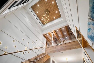 TIMELESS WATERFRONT MASTERPIECE IN EXCLUSIVE HARBOR BEACH! A