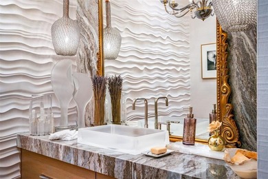 TIMELESS WATERFRONT MASTERPIECE IN EXCLUSIVE HARBOR BEACH! A