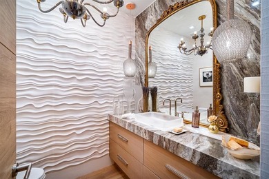 TIMELESS WATERFRONT MASTERPIECE IN EXCLUSIVE HARBOR BEACH! A