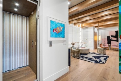 TIMELESS WATERFRONT MASTERPIECE IN EXCLUSIVE HARBOR BEACH! A