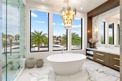 TIMELESS WATERFRONT MASTERPIECE IN EXCLUSIVE HARBOR BEACH! A