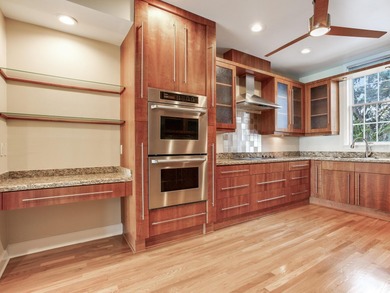 This corner, open-bay and downtown water view villa is truly a