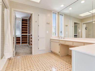 This corner, open-bay and downtown water view villa is truly a