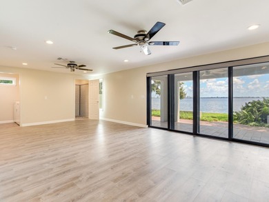 This corner, open-bay and downtown water view villa is truly a