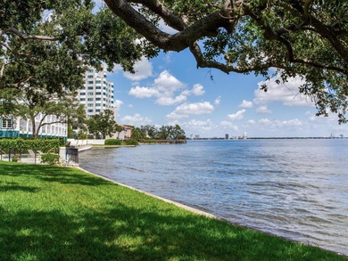 This corner, open-bay and downtown water view villa is truly a