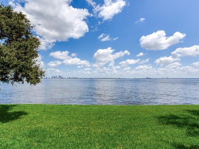 This corner, open-bay and downtown water view villa is truly a