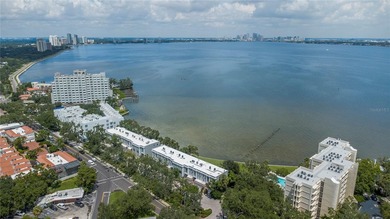 This corner, open-bay and downtown water view villa is truly a