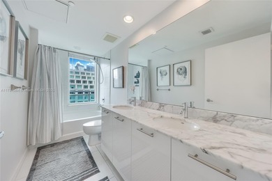 Live in the heart of Brickell with stunning city views from this