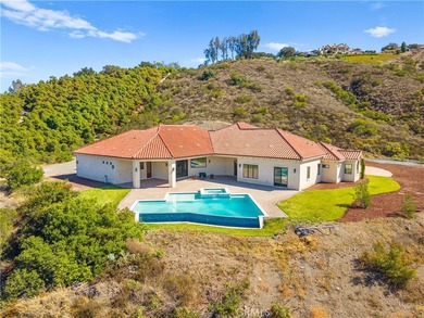 Perched high above Cross Creek Golf Course in the prestigious De