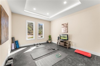 Perched high above Cross Creek Golf Course in the prestigious De