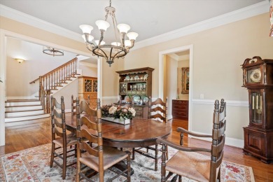 Nestled on a picturesque tree-lined street, this expansive home