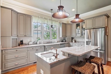 Nestled on a picturesque tree-lined street, this expansive home