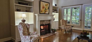 Nestled on a picturesque tree-lined street, this expansive home