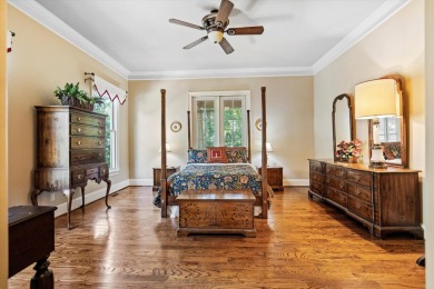 Nestled on a picturesque tree-lined street, this expansive home