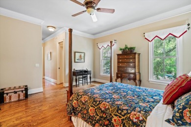 Nestled on a picturesque tree-lined street, this expansive home