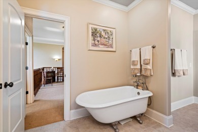 Nestled on a picturesque tree-lined street, this expansive home