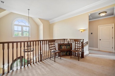 Nestled on a picturesque tree-lined street, this expansive home