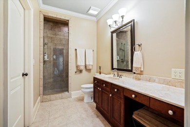 Nestled on a picturesque tree-lined street, this expansive home