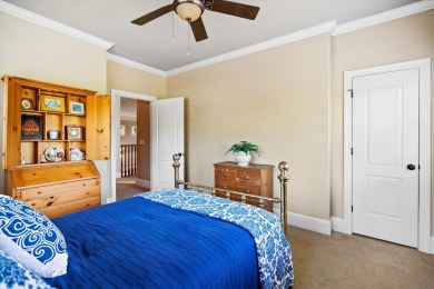 Nestled on a picturesque tree-lined street, this expansive home