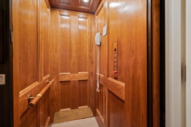 Nestled on a picturesque tree-lined street, this expansive home