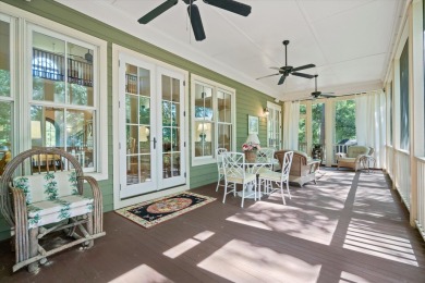 Nestled on a picturesque tree-lined street, this expansive home