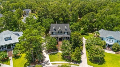 Nestled on a picturesque tree-lined street, this expansive home