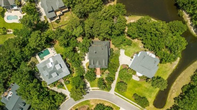 Nestled on a picturesque tree-lined street, this expansive home