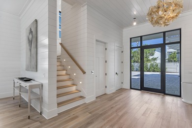 Experience elevated coastal living in this newly built, fully