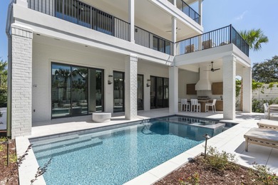 Experience refined coastal living in this newly built, fully