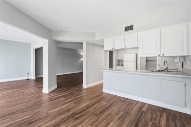 RARE 1,820 SF End Unit Condo with Stunning Golf Course Views!
