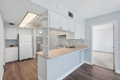 RARE 1,820 SF End Unit Condo with Stunning Golf Course Views!
